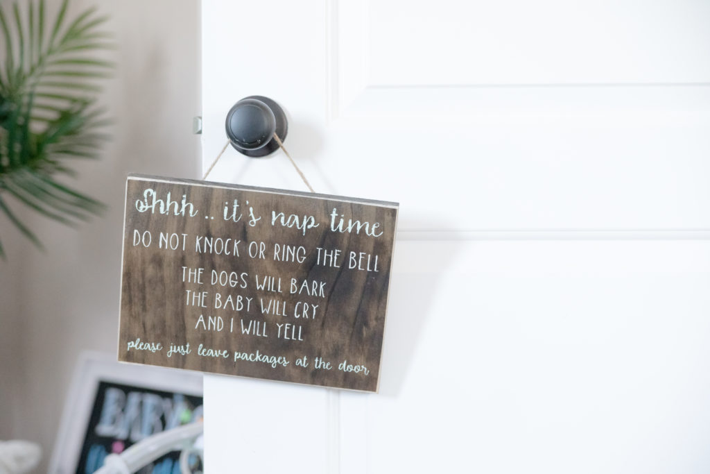 sign hangs on nursery door