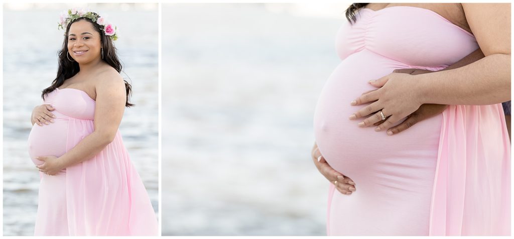 Pregnant woman stands near the water in pink maternity dress