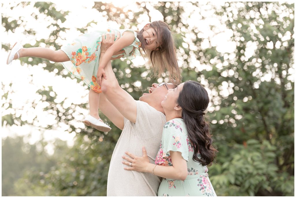 pregnancy photos with a toddler being tossed in the air