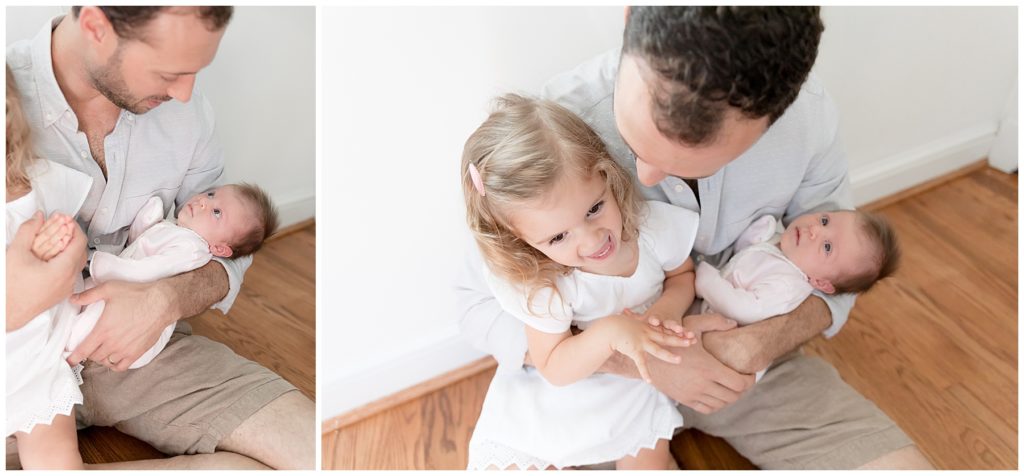 daddy snuggles with daughters during lifestyle newborn  photo session