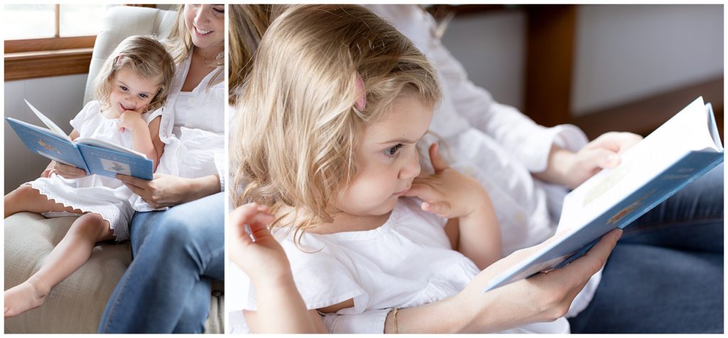 toddler sits with mom to read a book