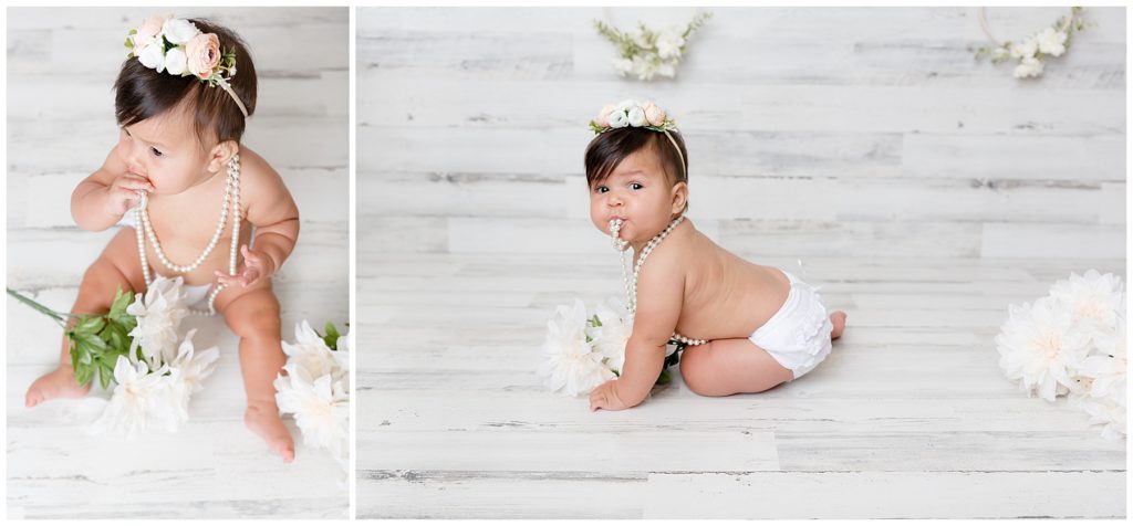 Baby girl poses in white bloomers at her 6 month sitter session