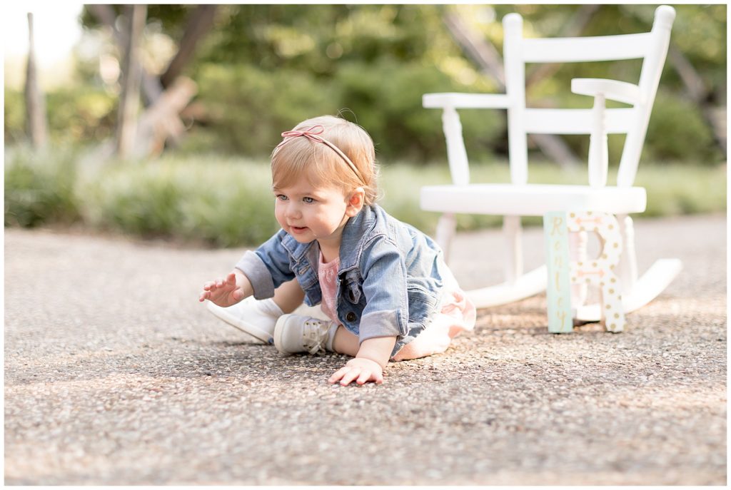crawling baby is on the move during first birthday photos