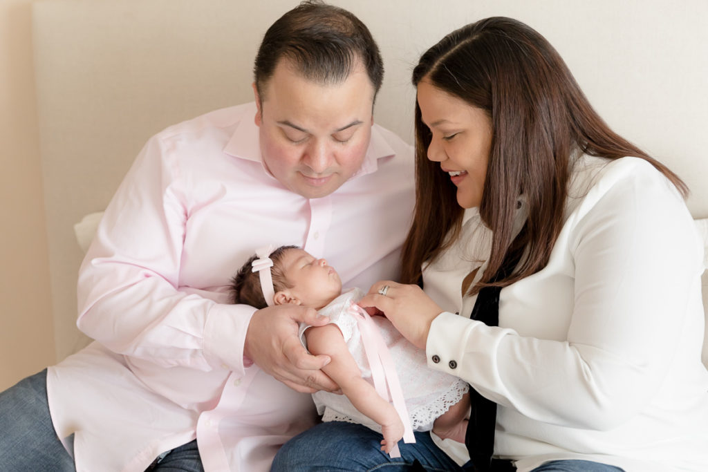 Mom and dad looked thrilled with baby at lifestyle newborn photo session