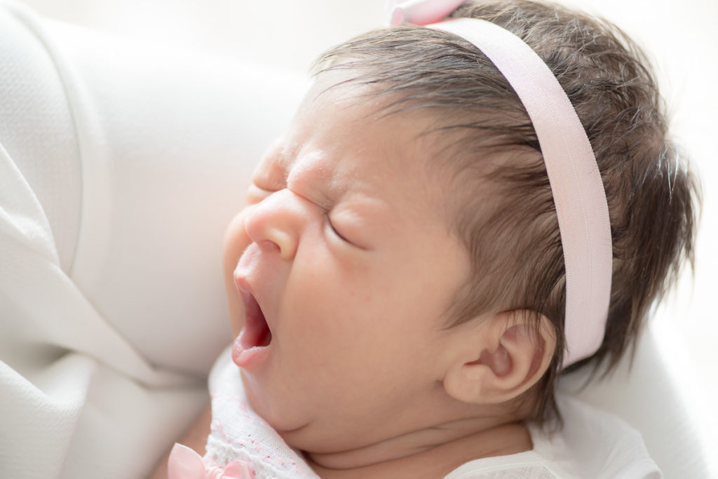 Sweet newborn yawn