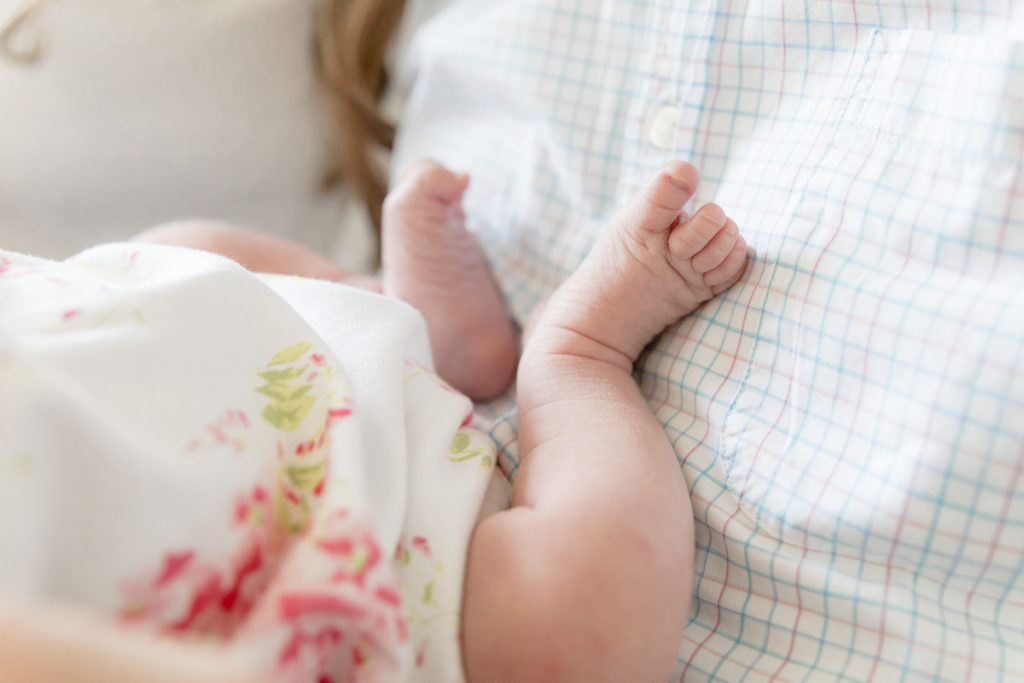 in-home newborn photos showcase tiny toes