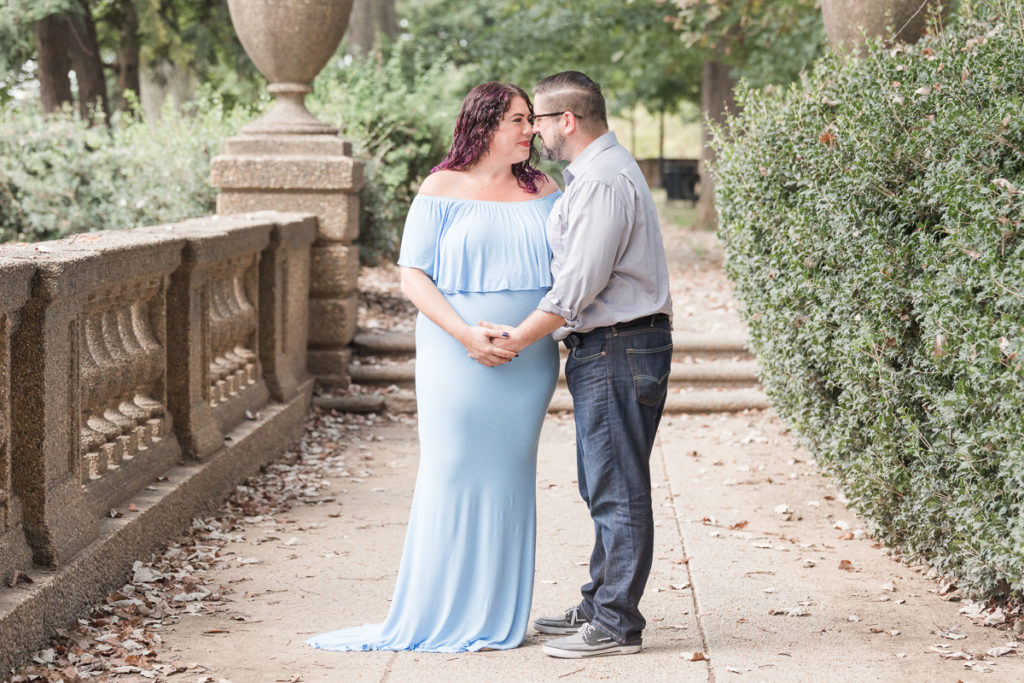 husband and pregnant wife in blue dress