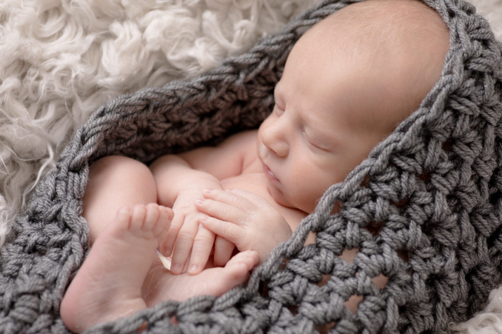 newborn babe in crocheted cocoon