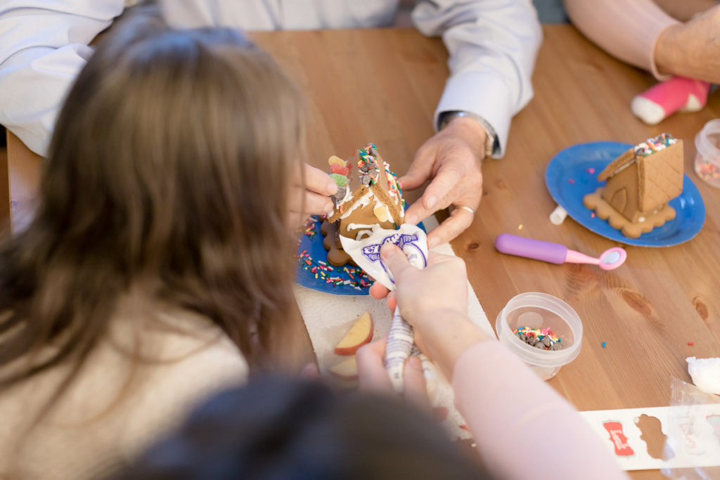 child watches gingerbread being created