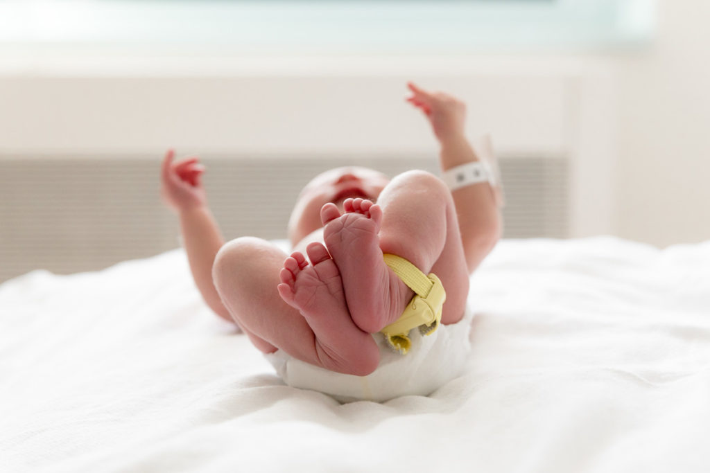 baby on bed to capture newborn photos right after birth