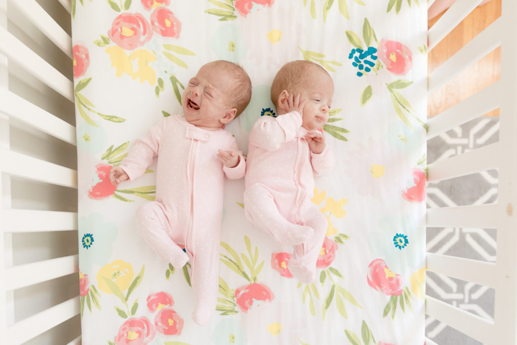 newborn twins in crib