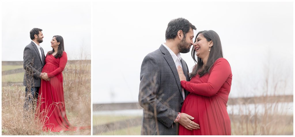 husband loves on pregnant wife in red maternity dress