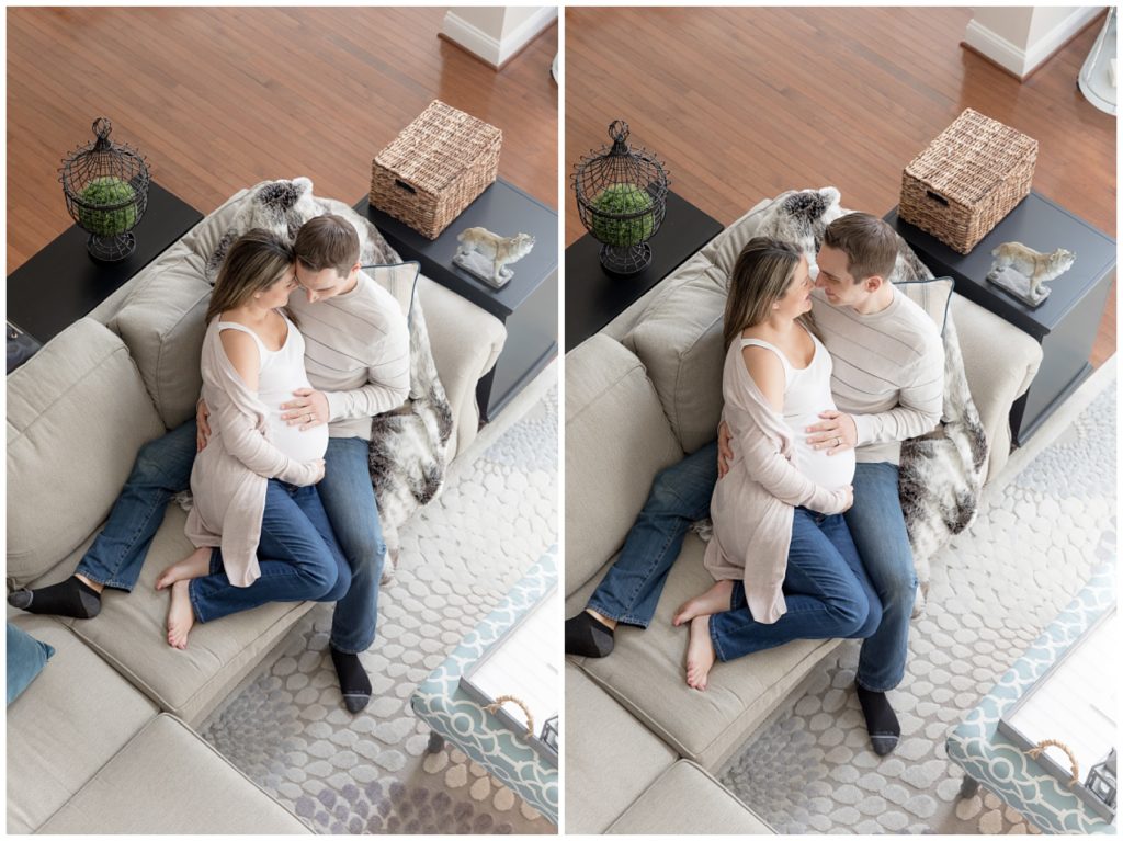 pregnant couple snuggles on couch during maternity photo session
