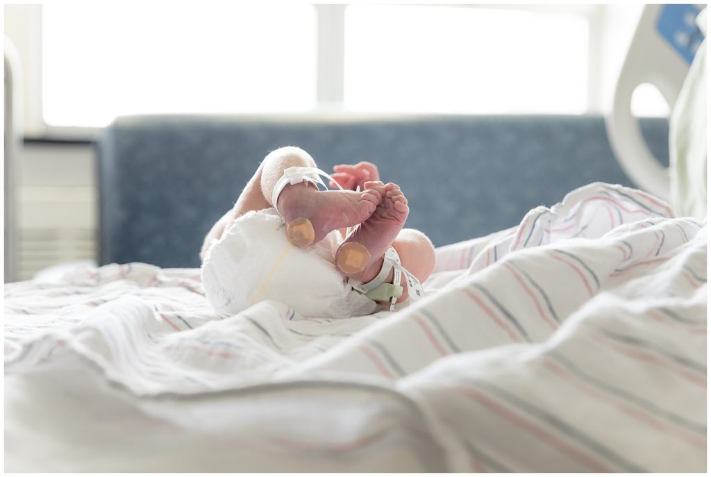 squishy newborn on mom's hospital bed