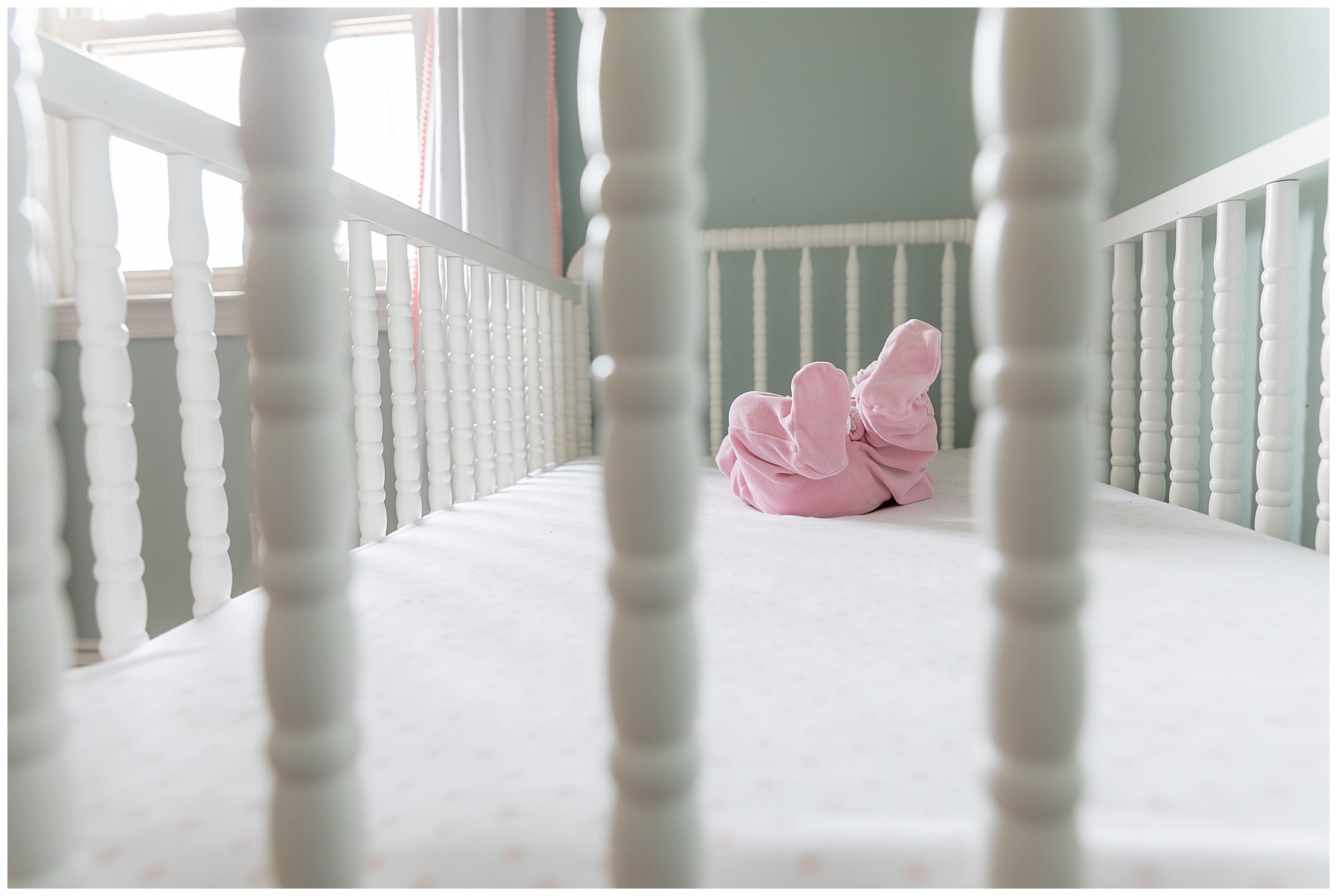 perspective shot, newborn in crib