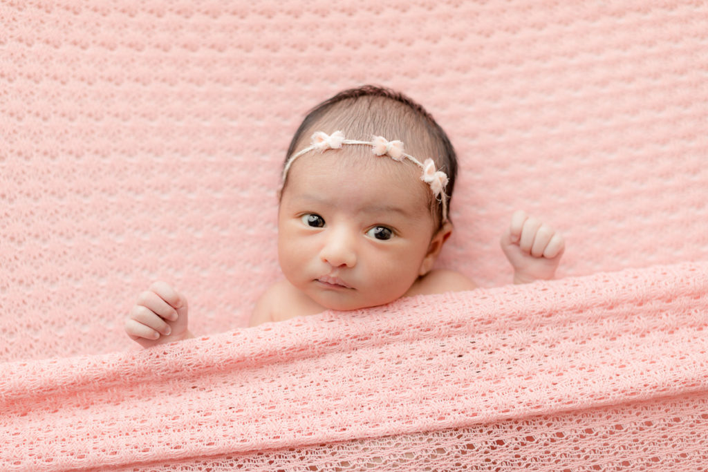 wide awake newborn with pink bow headband