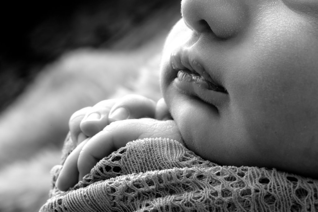 black and white newborn lips and hands
