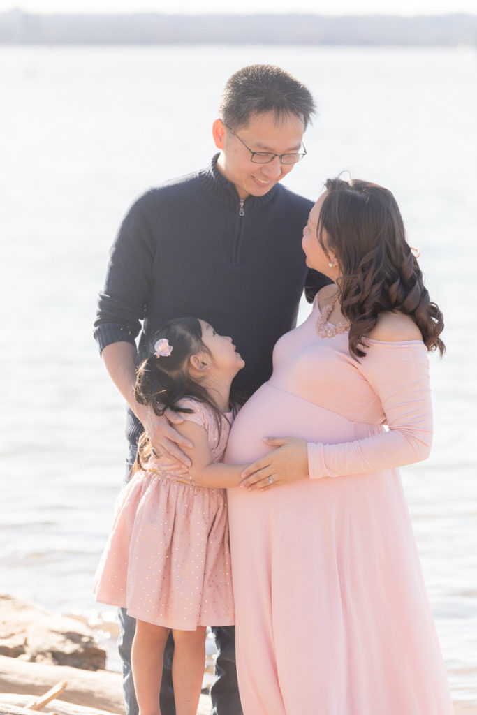 family snuggle time during maternity photos