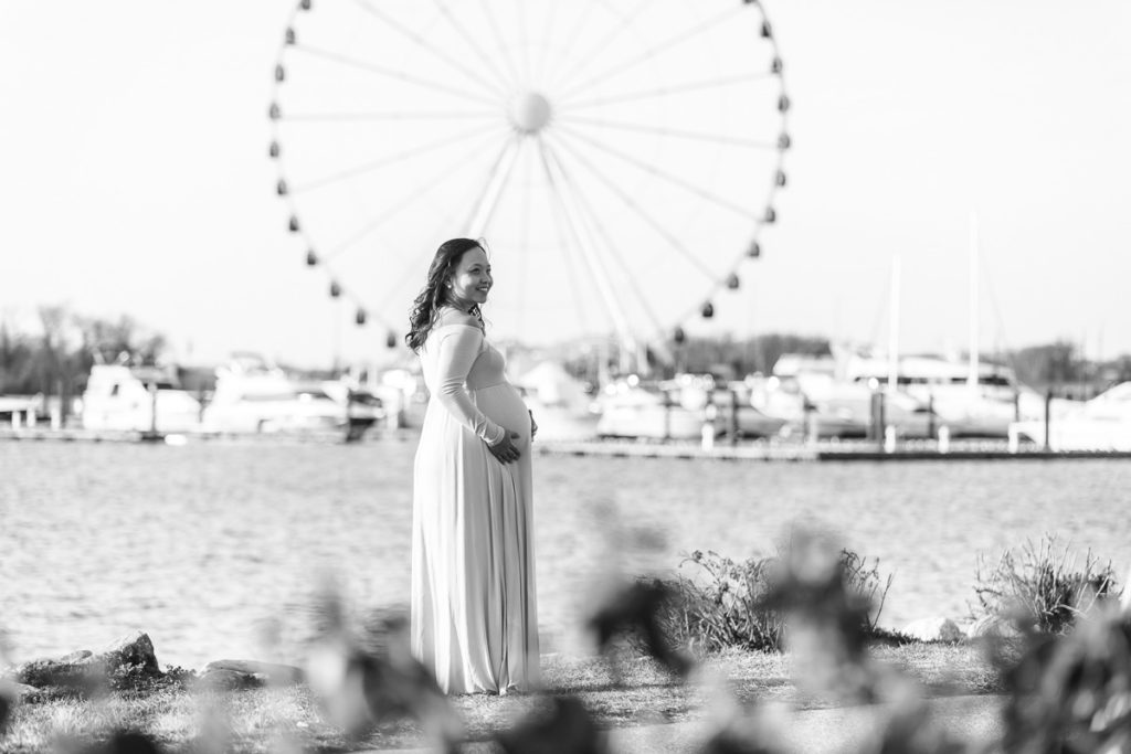 National Harbor maternity photos in front of Harbor wheel