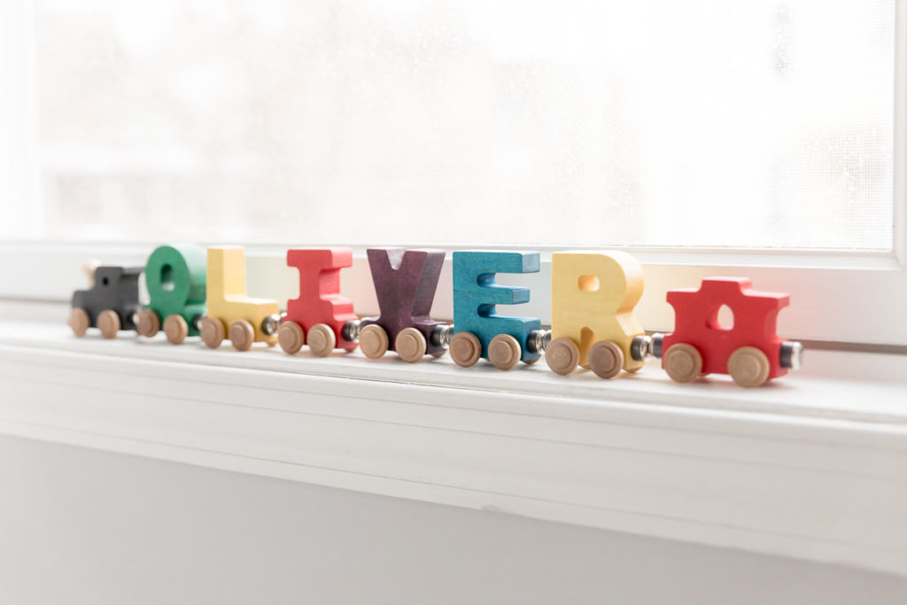 nursery train decor spells out Oliver