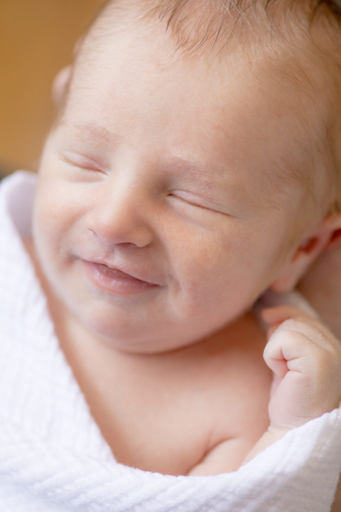 catching smiles from giving newborn photos as a gift