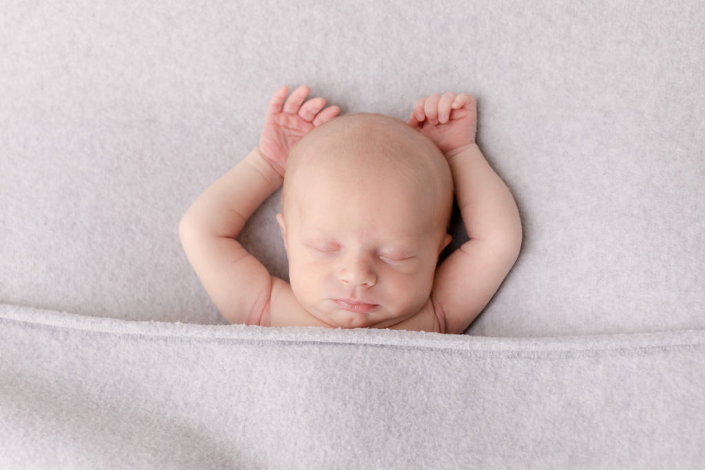 arms up, posed studio newborn photos