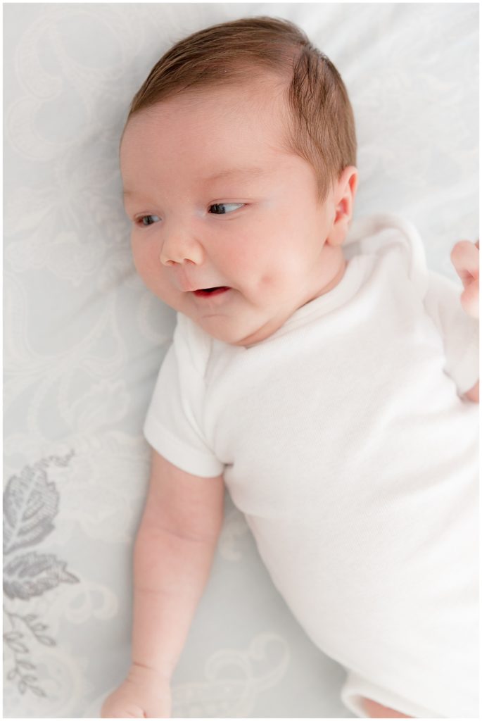 newborn boy flashes dimples at Maryland newborn photographer
