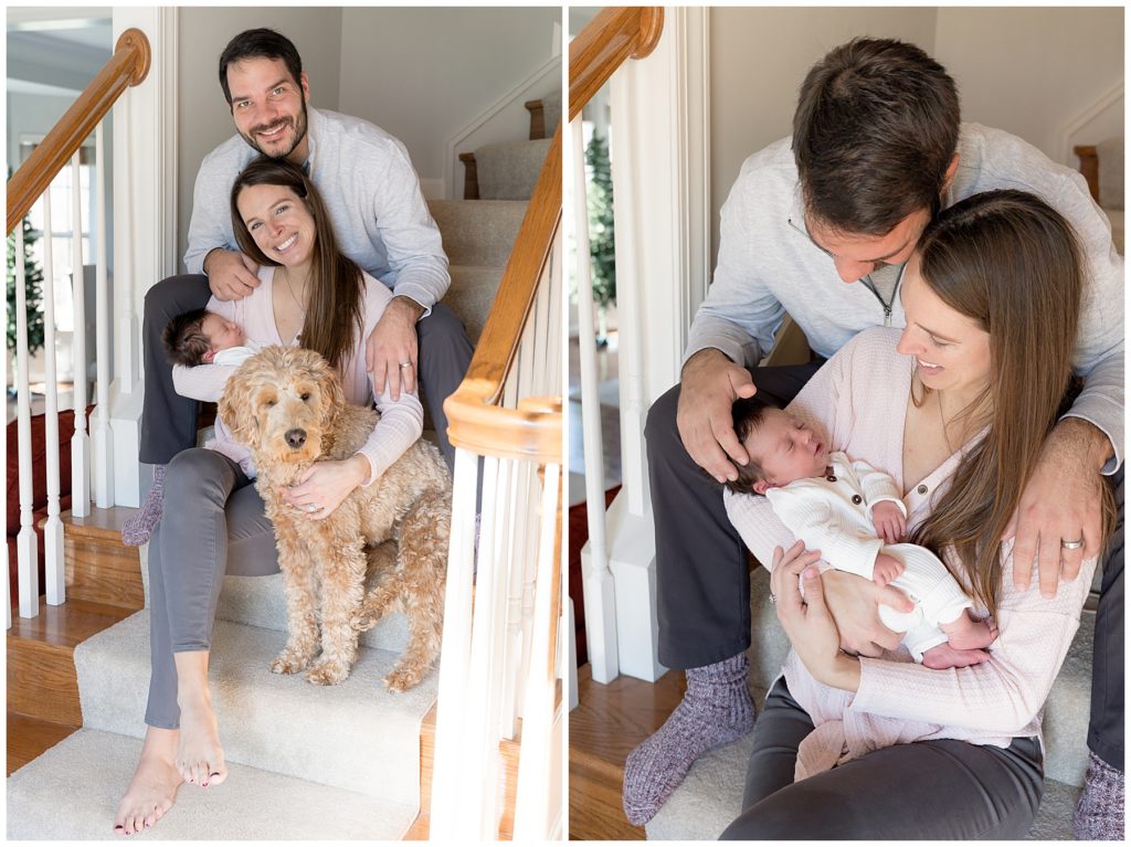 family poses with new baby on stairs