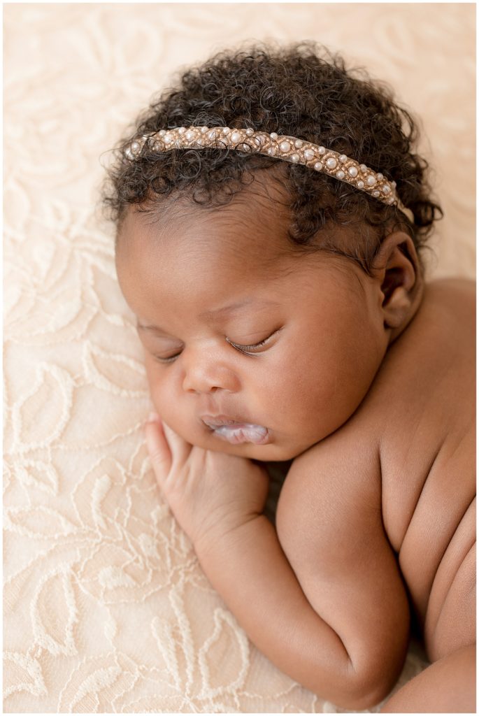 black newborn baby with gorgeous beaded headband