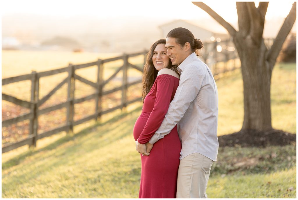 couple hugs and snuggles during Woodlawn Manor maternity photos