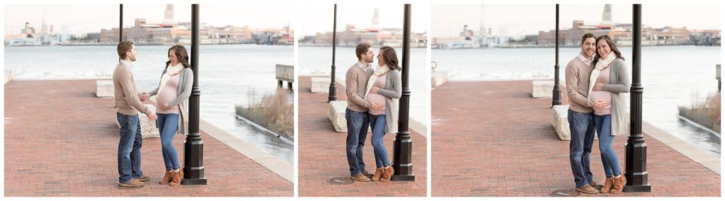 couple poses for Fells Point maternity session