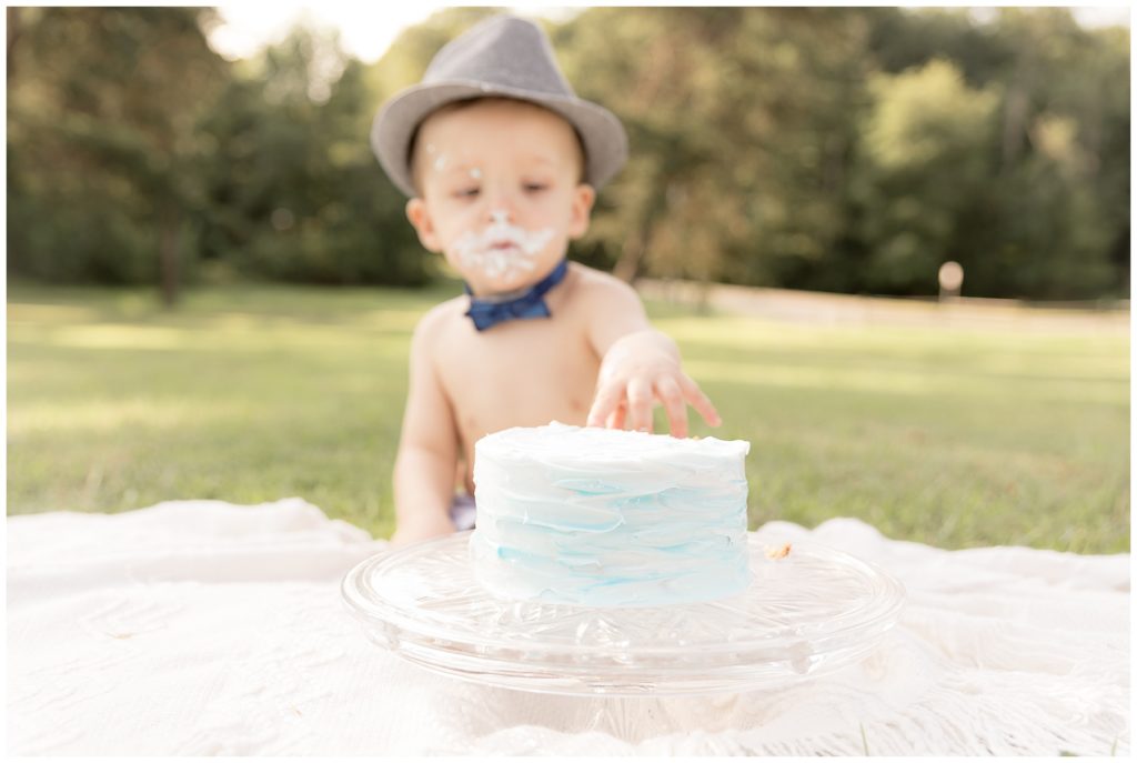 cake in foreground, birthday boy in background