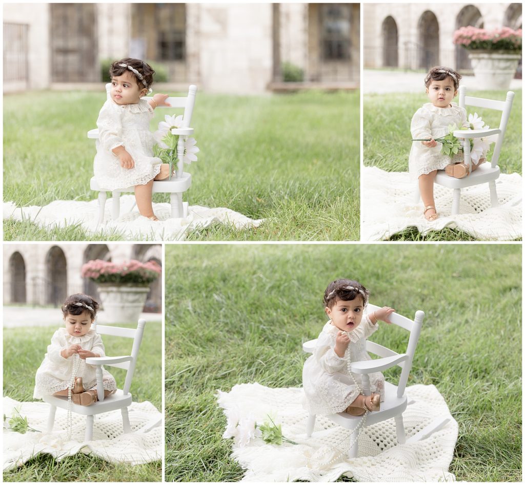 baby sits on white rocking chair