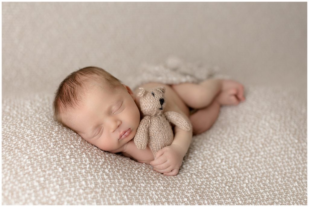 side lying newborn photography pose