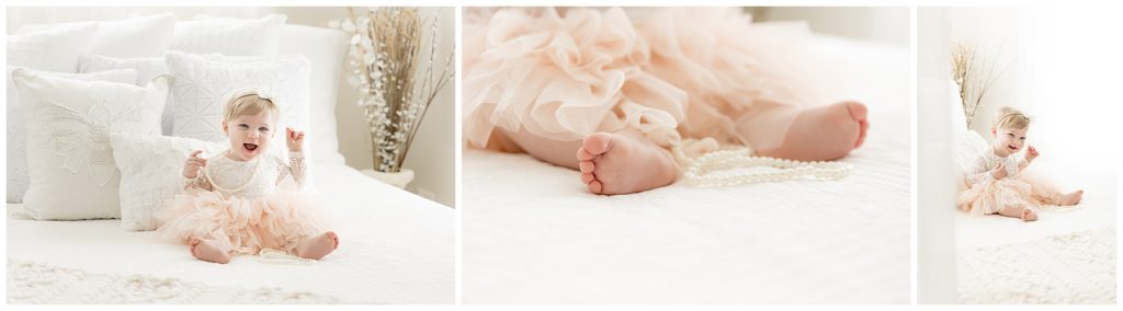 one year old girl portraits on white bed