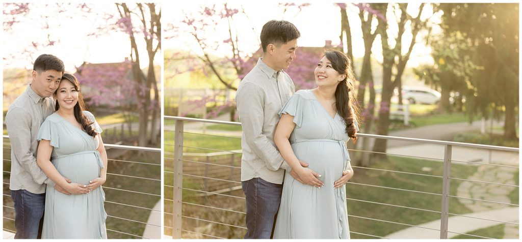 pregnant wife smiles up at husband