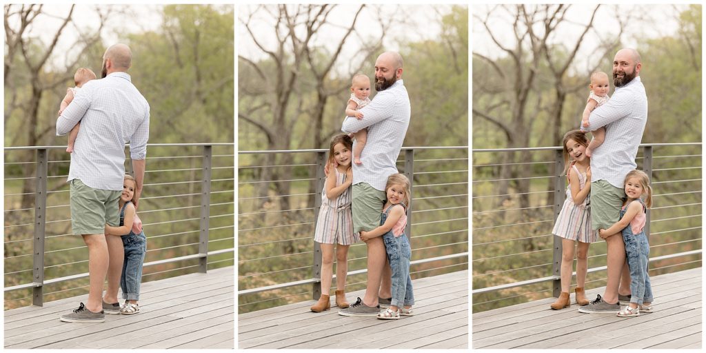 dad stands with daughters on Howard County Conservancy deck