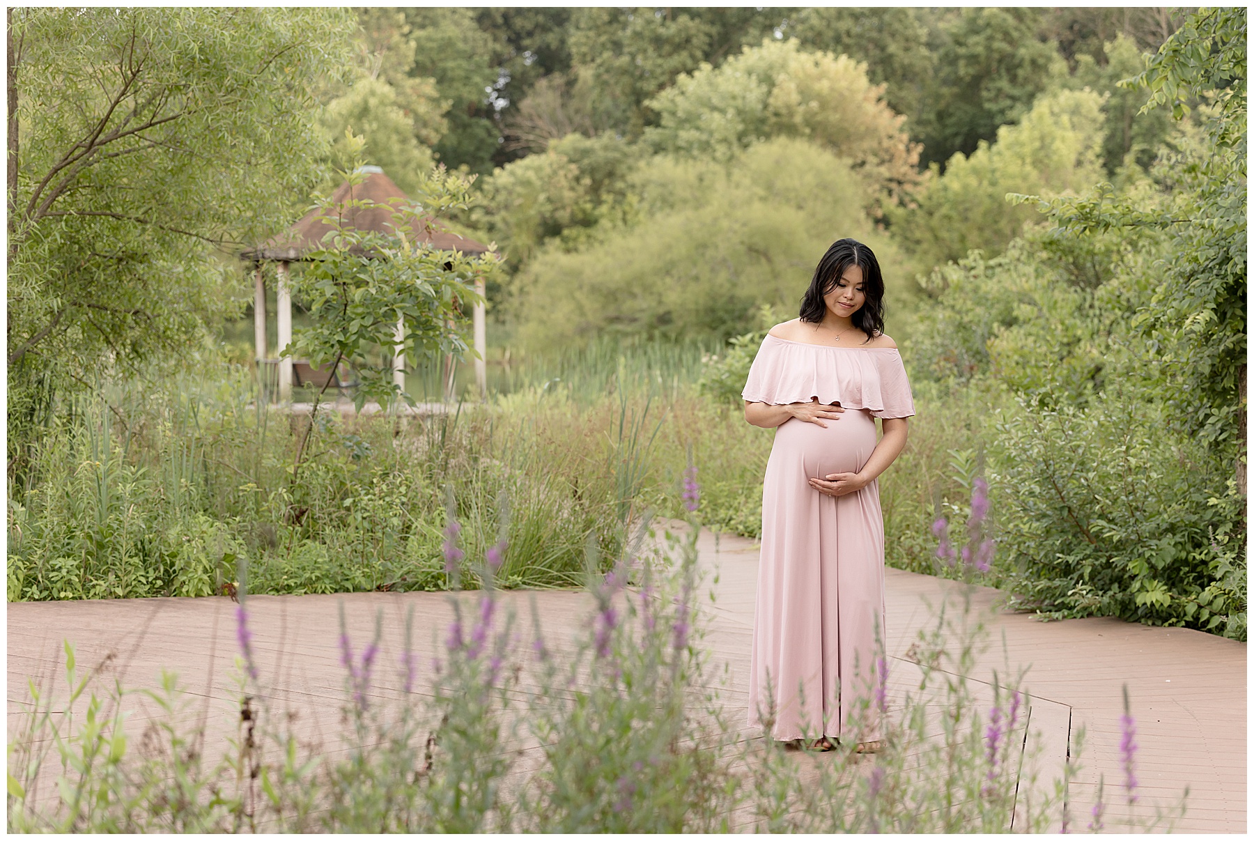 pregnant momma surrounded by boardwalks and greenery