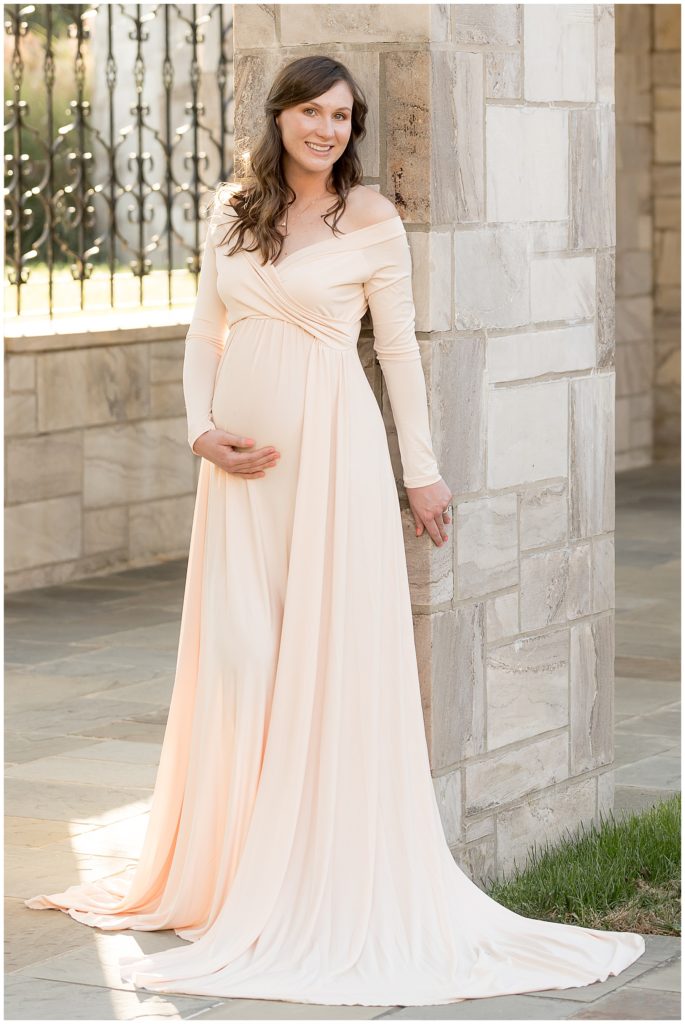 gorgeous, flowing maternity dress drapes the floor