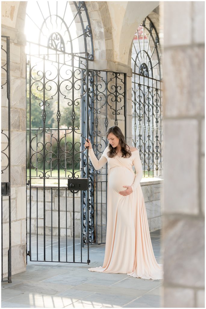 beautiful light highlights gorgeous, flowing maternity gown