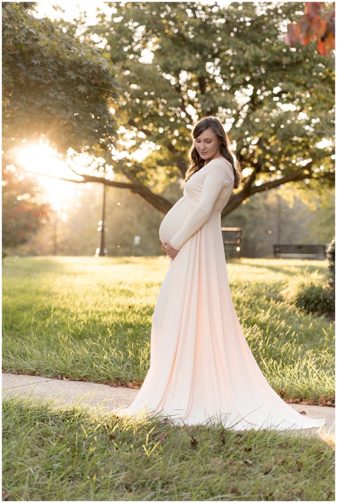 pregnant momma poses in golden hour light