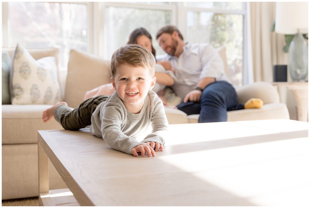 toddler front and center with parents blurred in the background