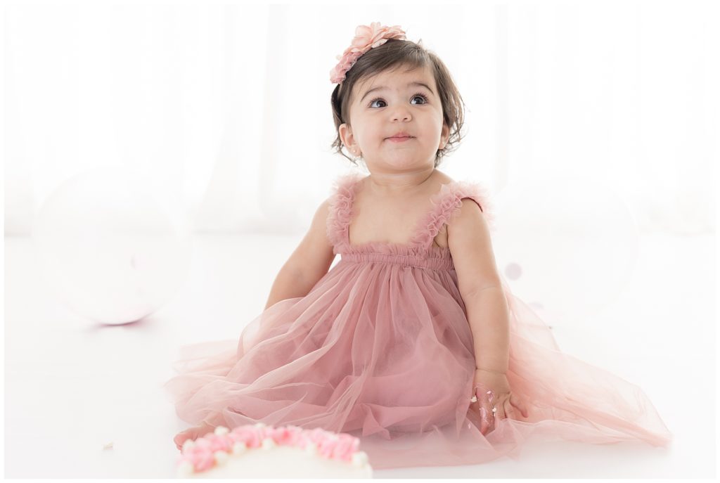 smiley baby in pink tulle dress
