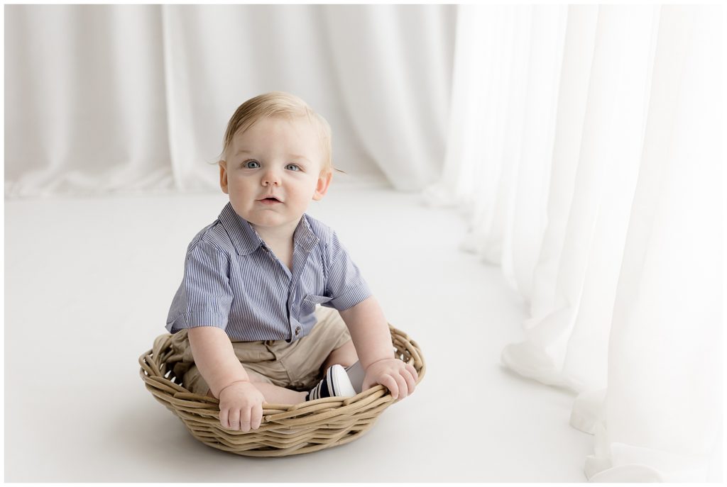 prepare for baby's sitter session - blue-eyed baby on all white background