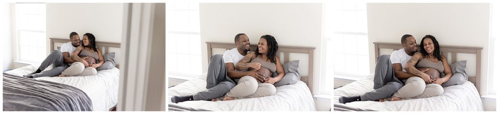 credit to your photographer - pregnant couple snuggles on bed