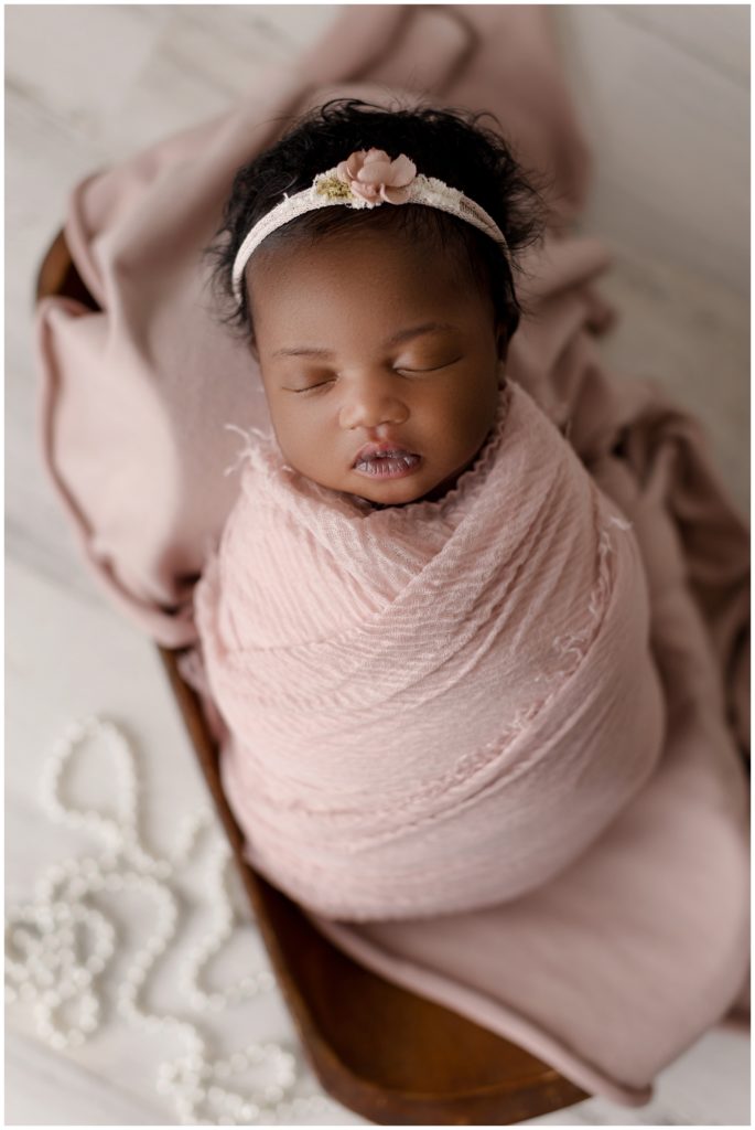 beautiful newborn girl in blush