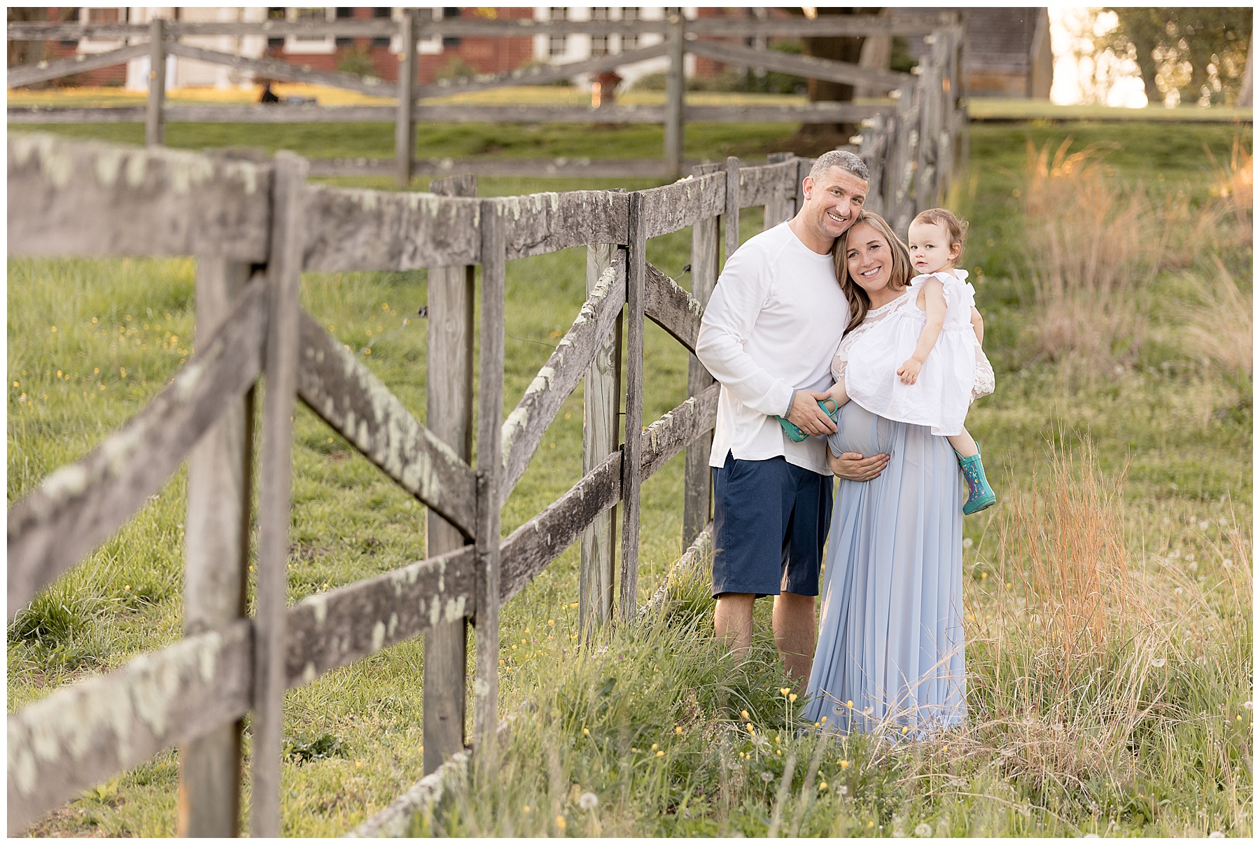 family portrait against fence, Best Maternity Photographer