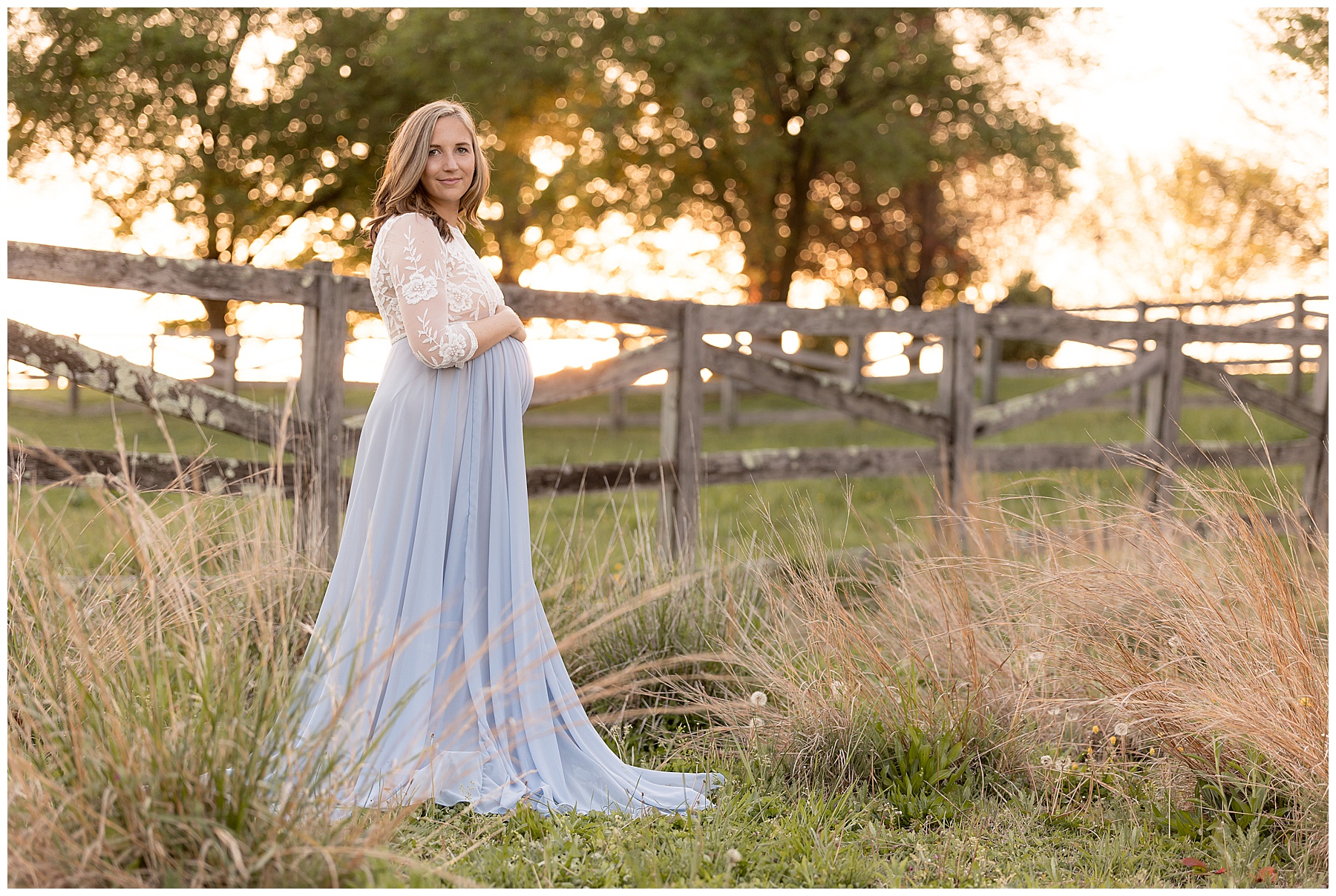 pregnant woman in blue dress at golden hour