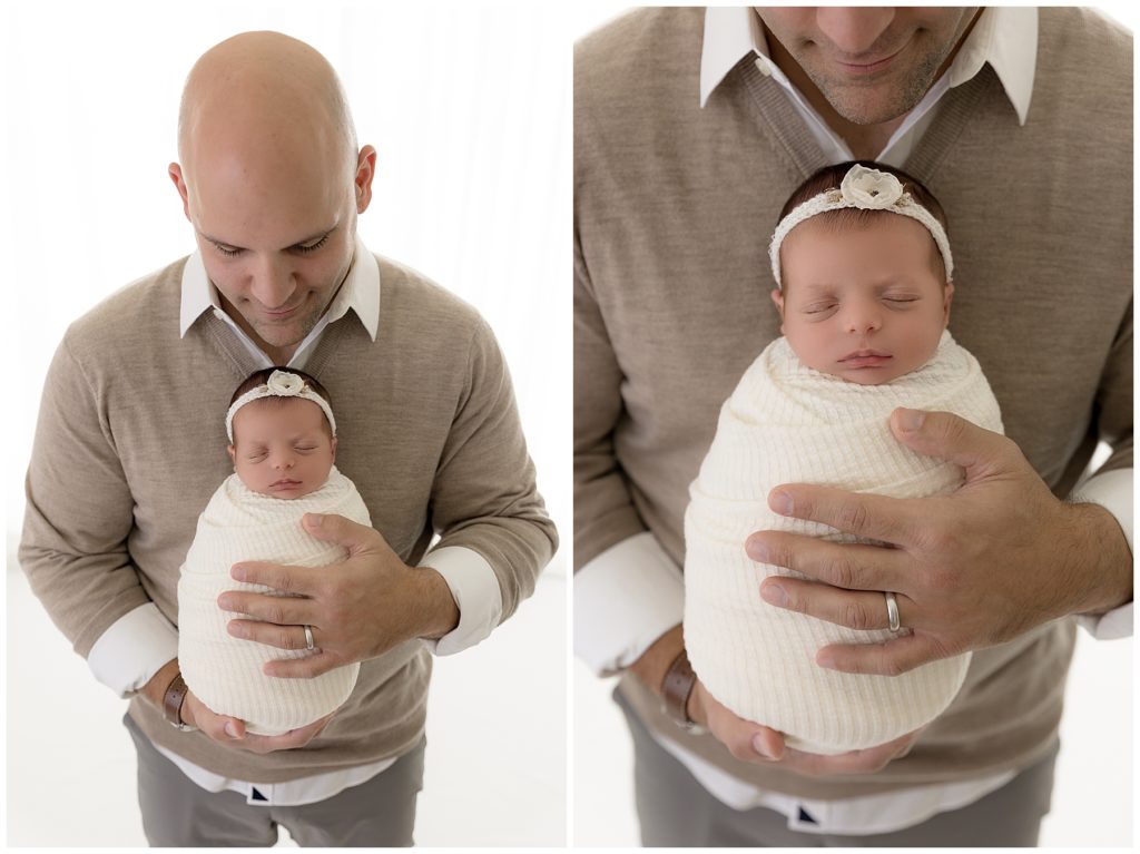 dad poses with newborn daughter, Newborn photos with a nurse