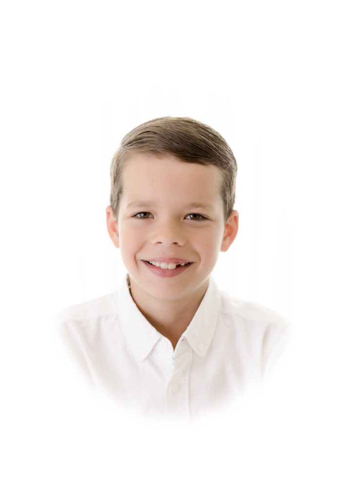 Heirloom Portraits show young boy in white shirt